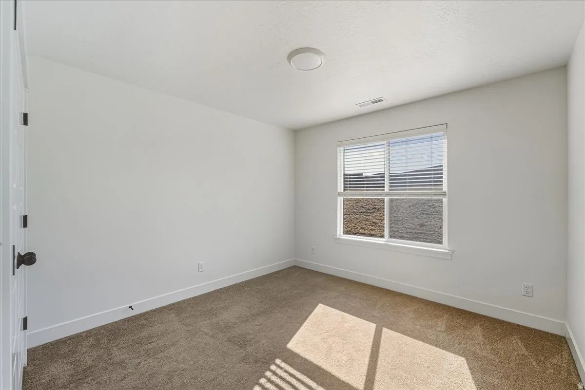 Spare room with light carpet