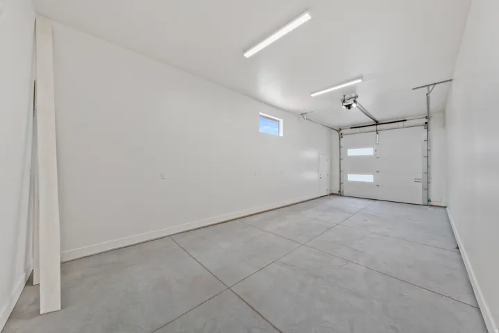 Garage featuring baseboards