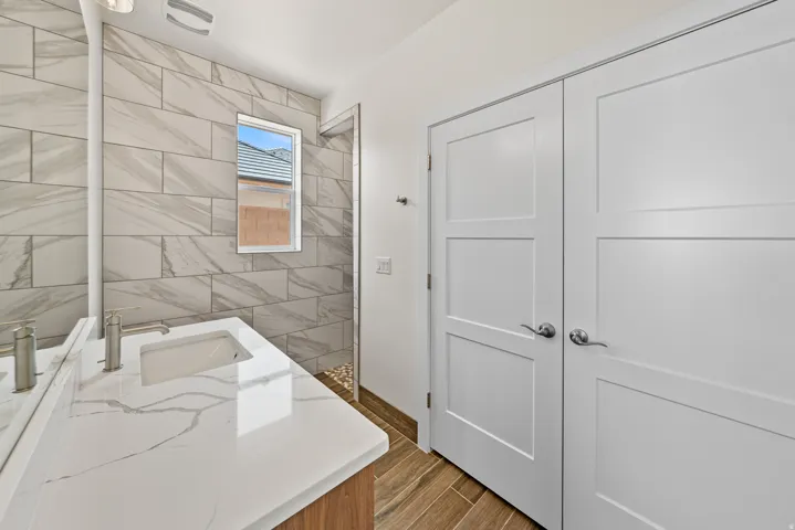 Bathroom with vanity and wood finish floors