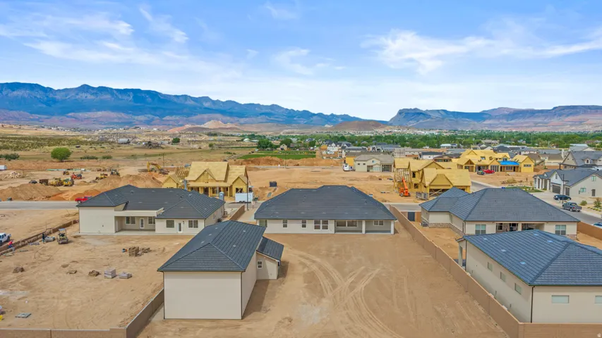 Aerial perspective of suburban area with a mountainous background