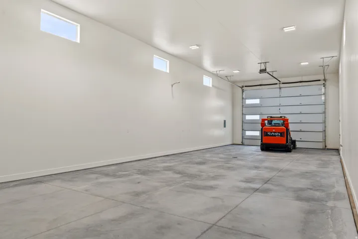 Garage featuring baseboards