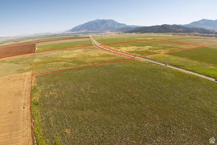 View of rural area with property parcel outlined and a mountainous background