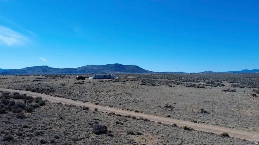View of mountain backdrop featuring a desert landscape