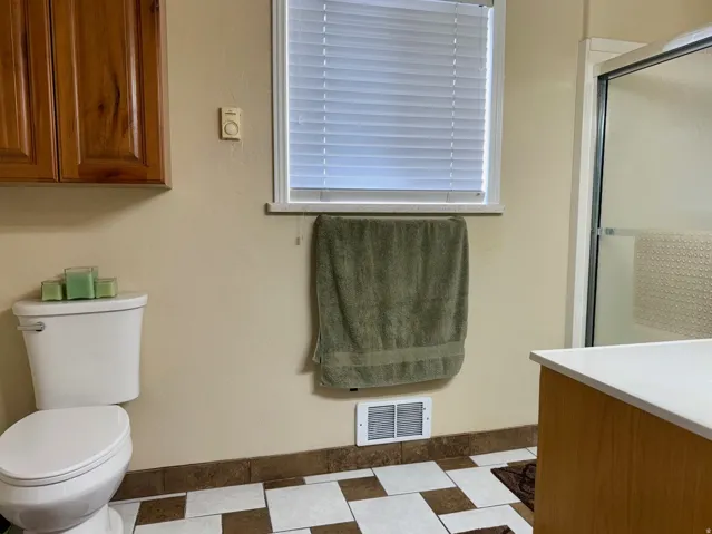 Bathroom with a stall shower and vanity
