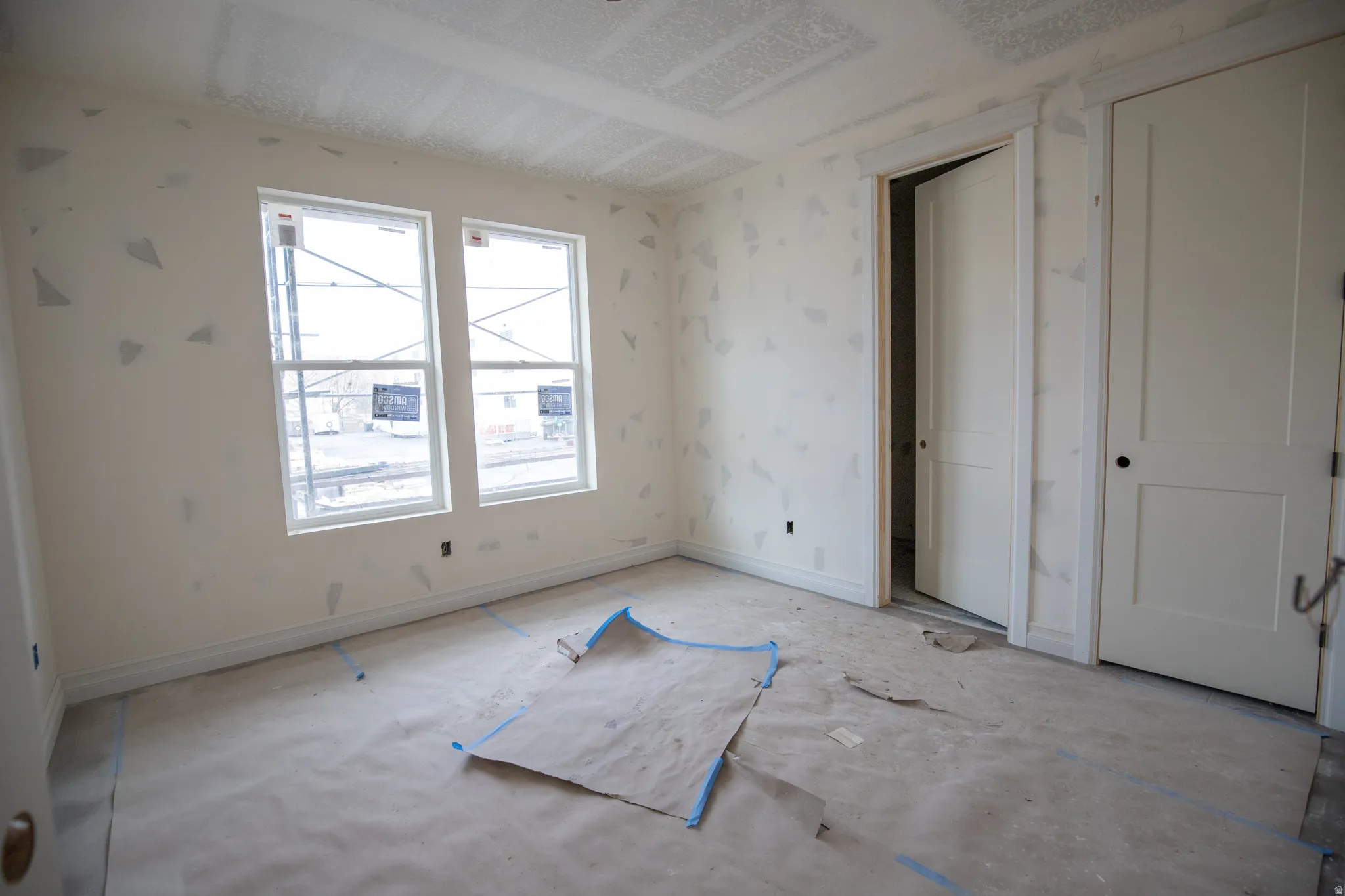 Unfurnished bedroom with baseboards