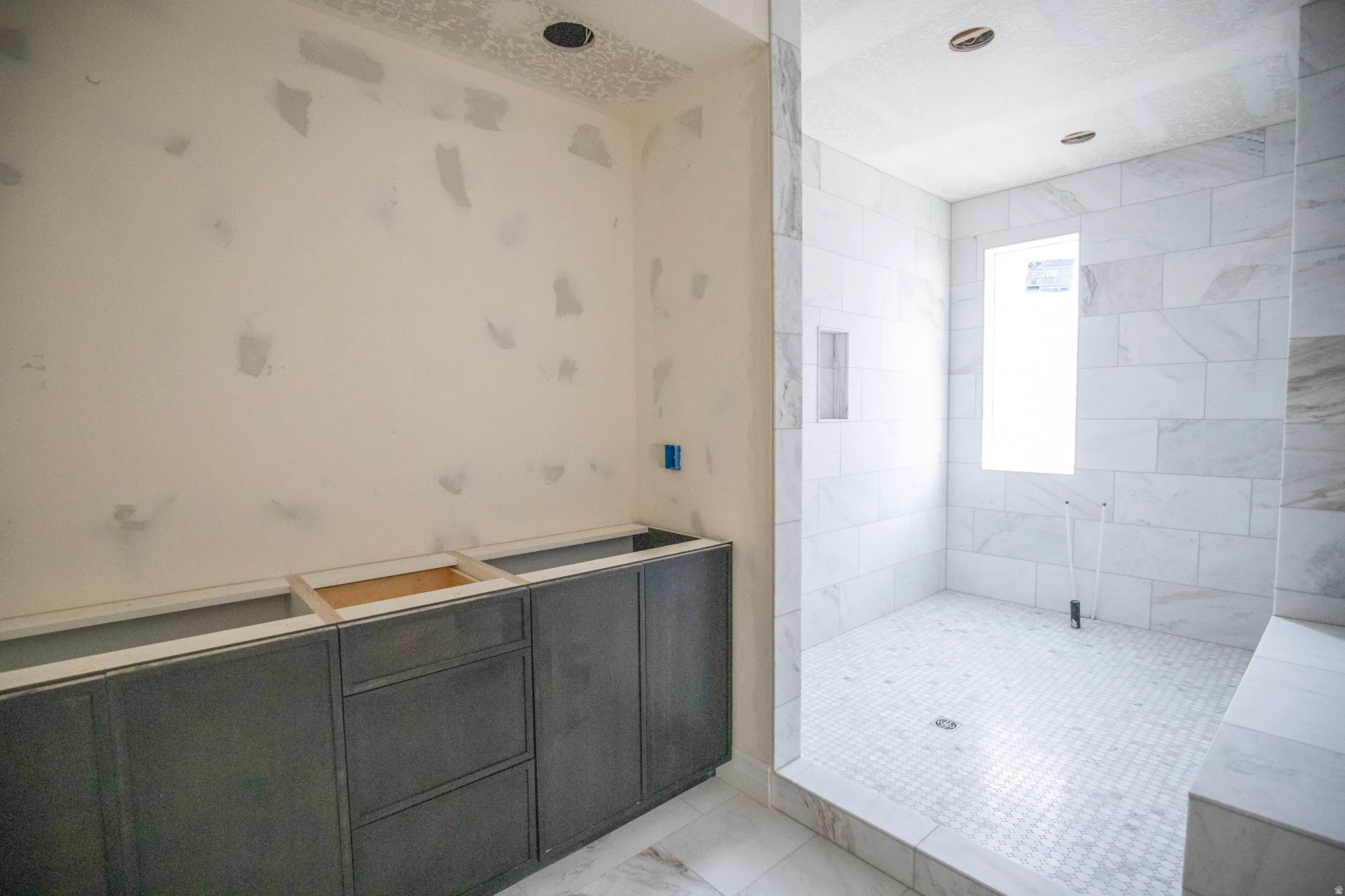 Full bathroom with tiled shower