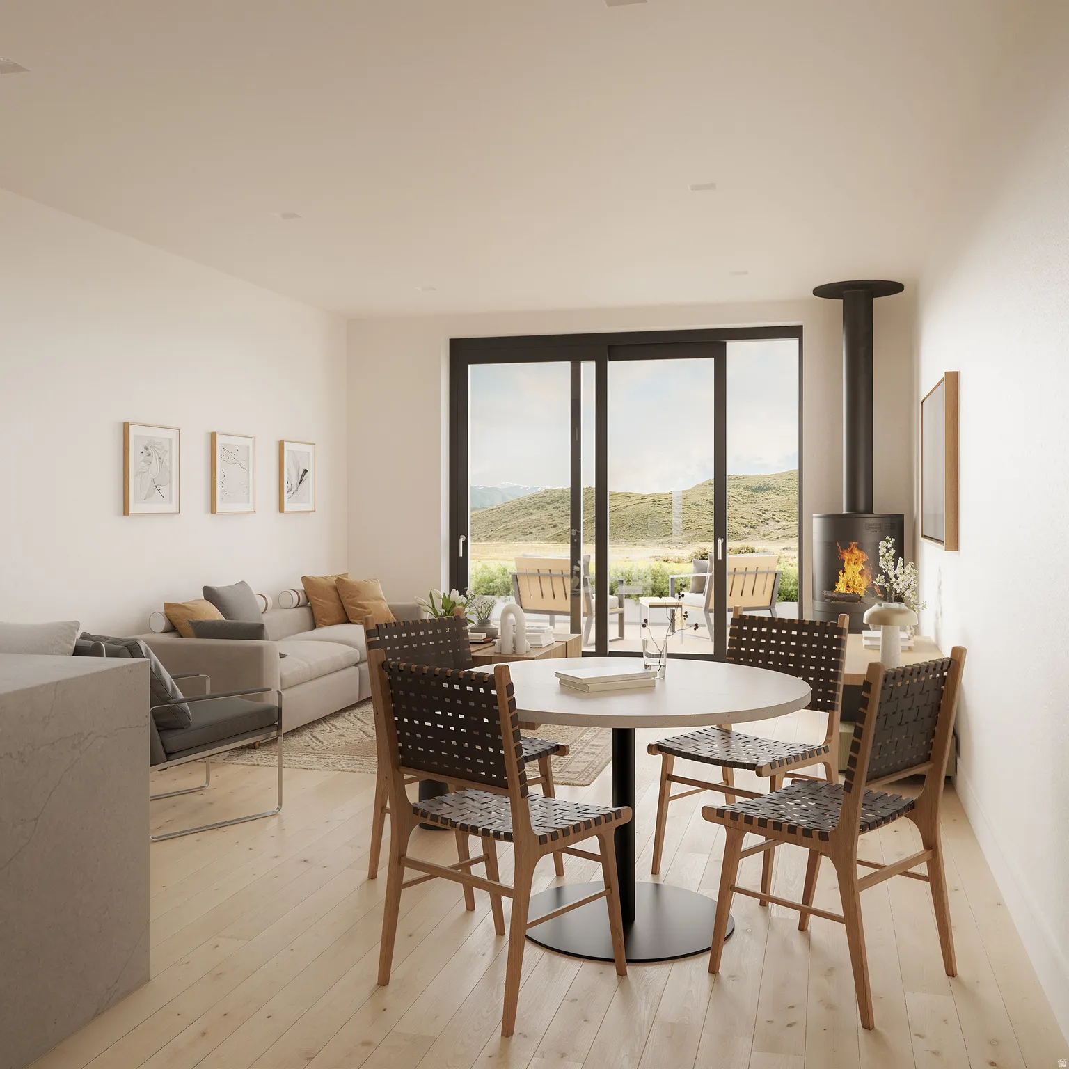 Dining space featuring light wood-type flooring, a wood stove, and a mountain view