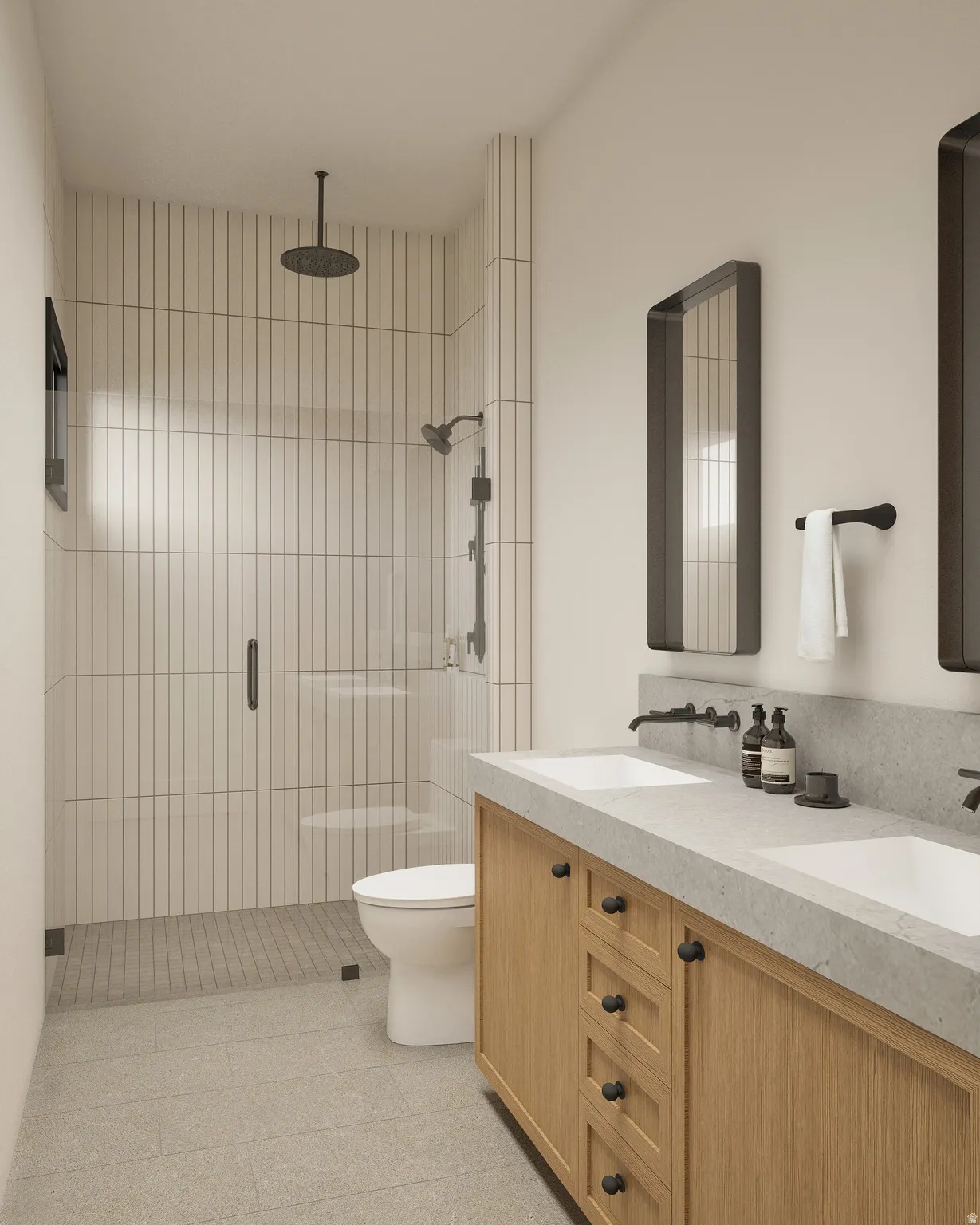 Bathroom with a tile shower and double vanity