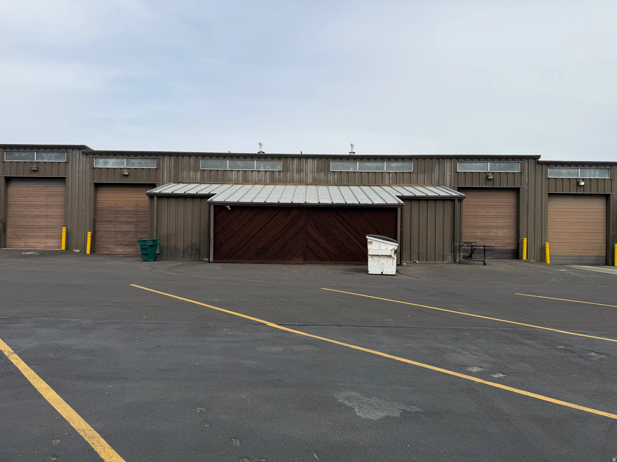 View of parking with community garages