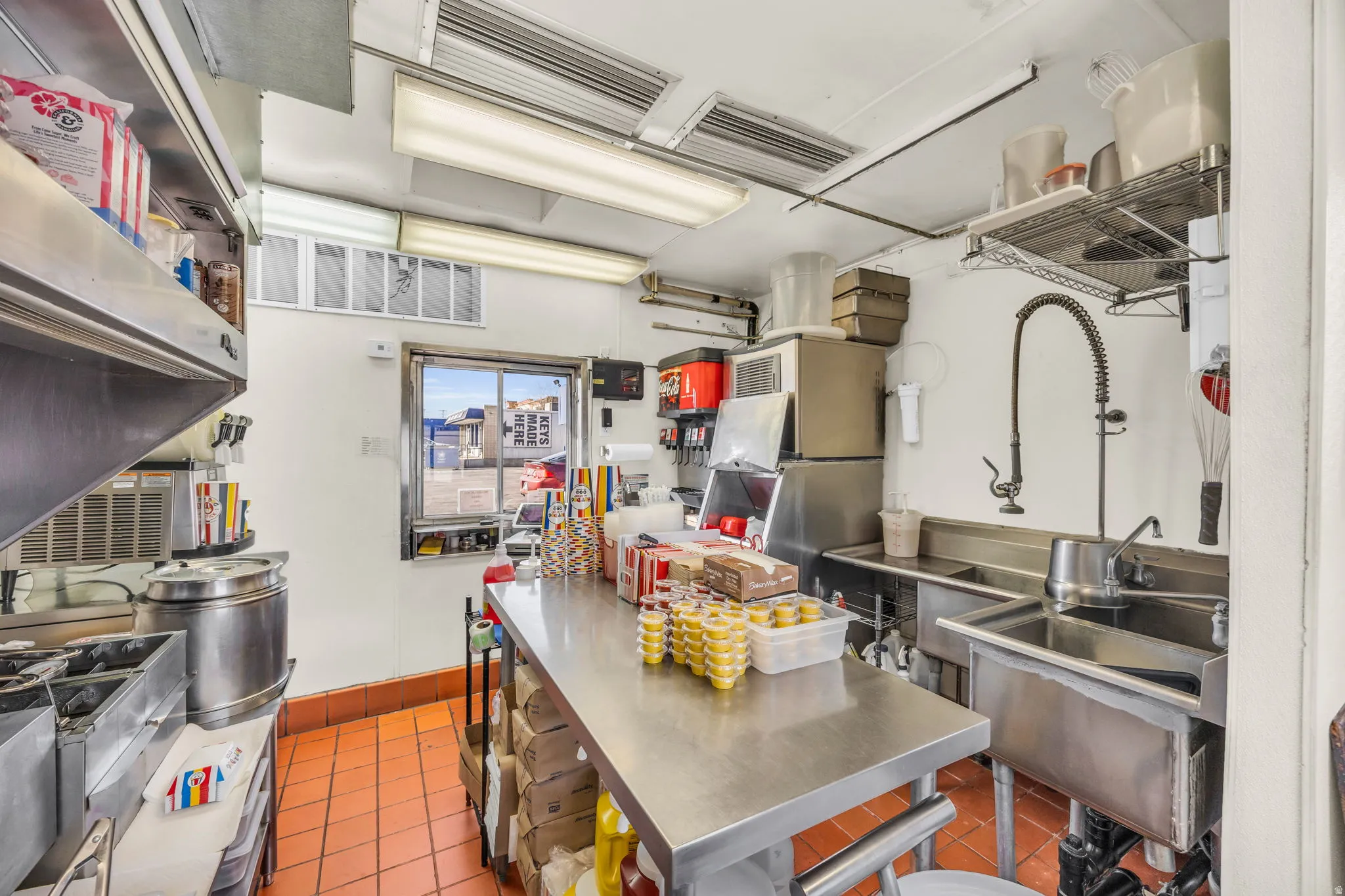 Kitchen with stainless steel countertops and a sink