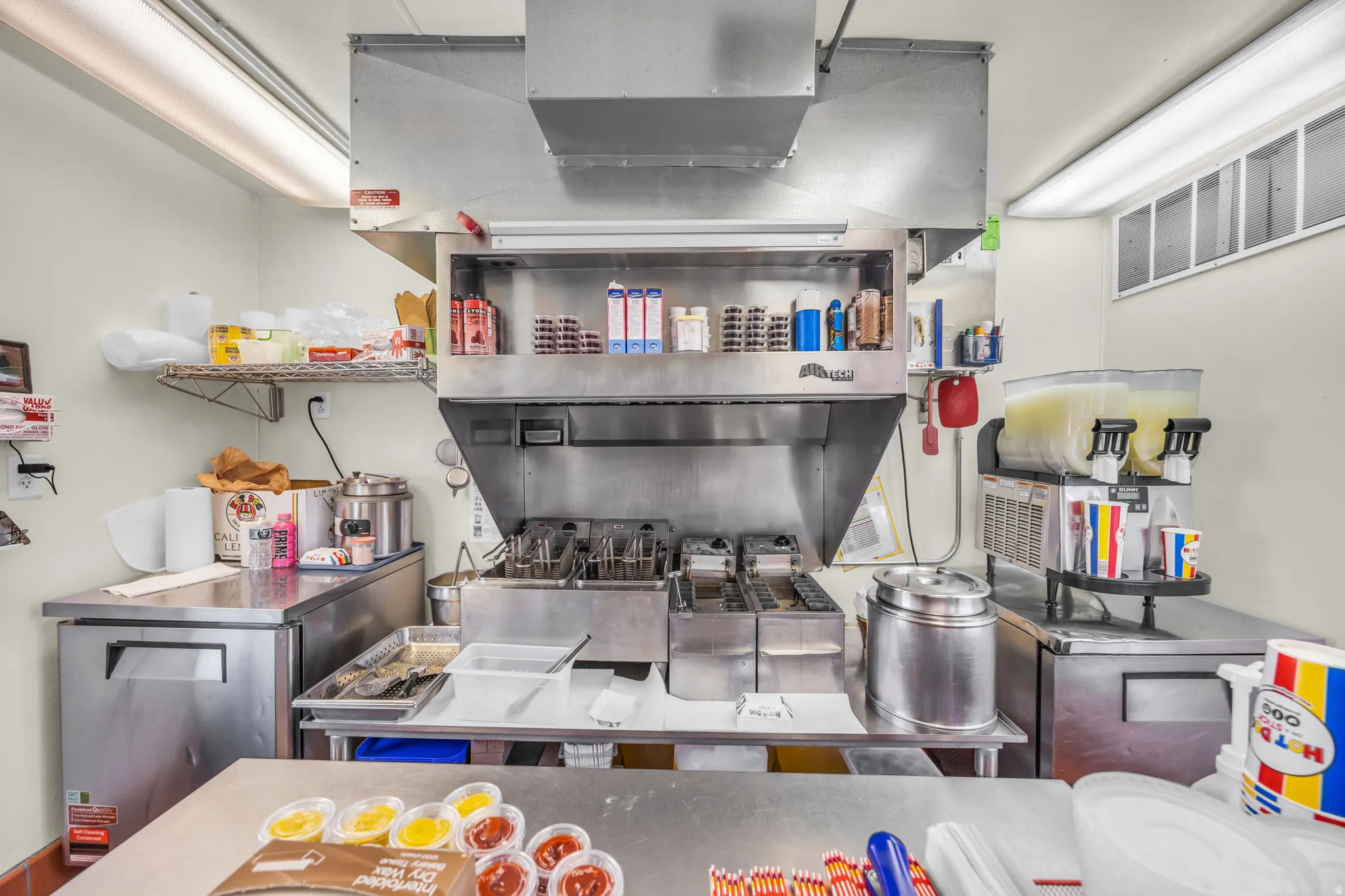 Kitchen with stainless steel countertops and stainless steel fridge