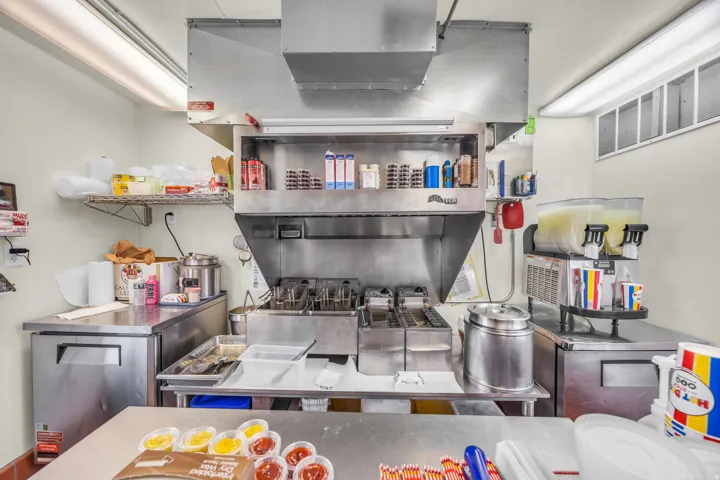 Kitchen with stainless steel countertops and stainless steel fridge