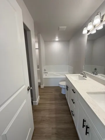 Dual vanity with solid surface countertops and undermount sinks