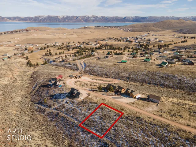 View of property location with property parcel outlined and a water and mountain view