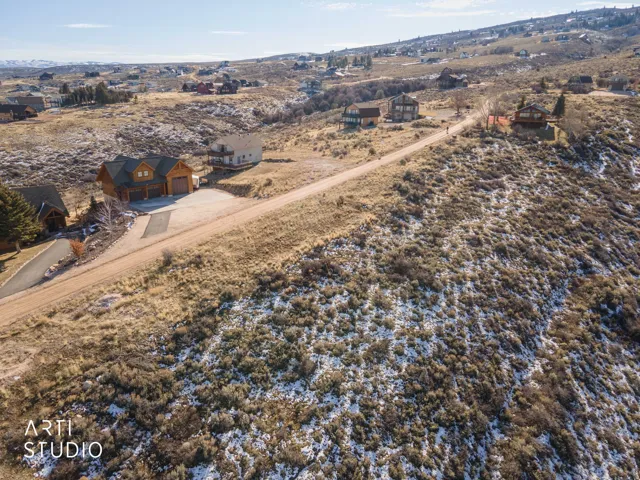 Aerial overview of property's location featuring nearby suburban area