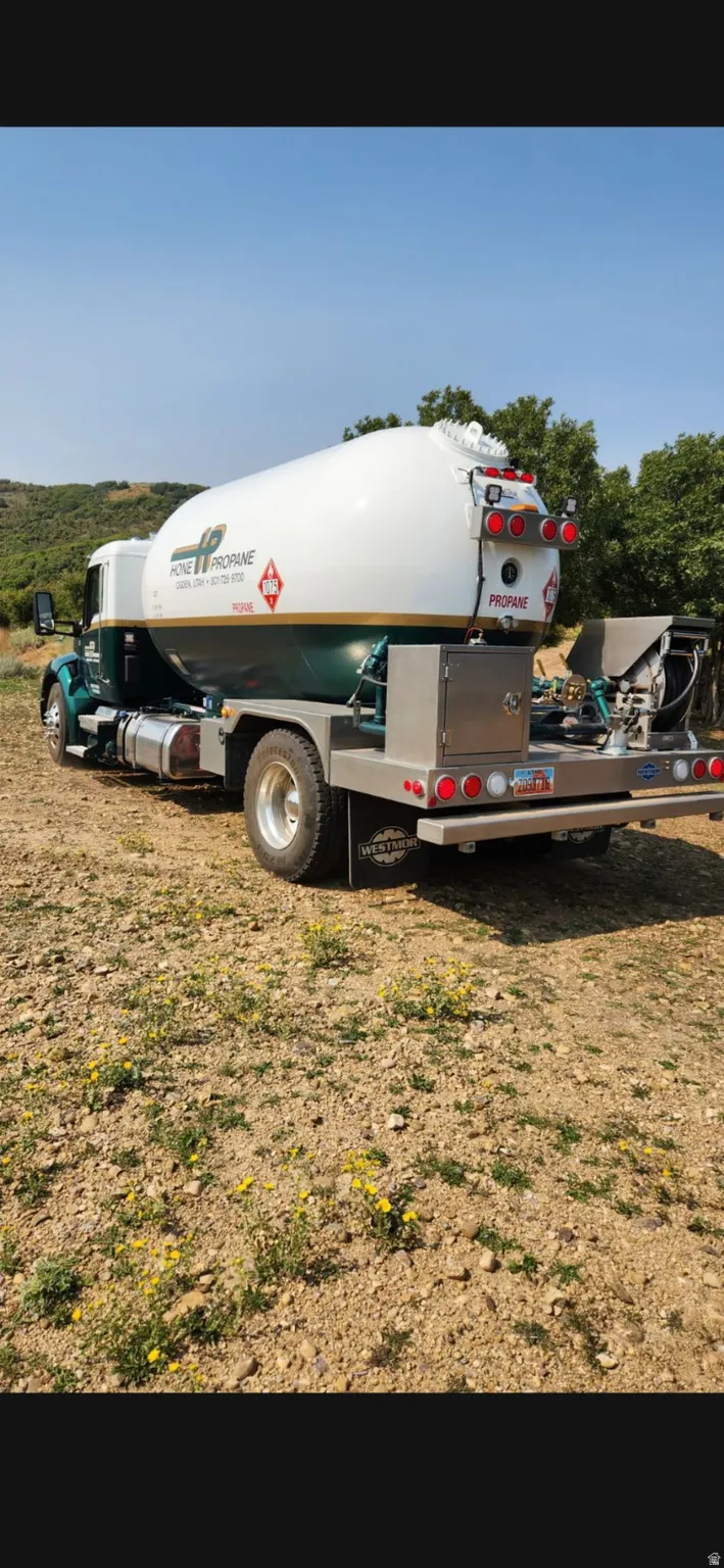 Large Propane Truck that delivers YOUR Personal Propane.  Note the Size that easily goes up to the Property!