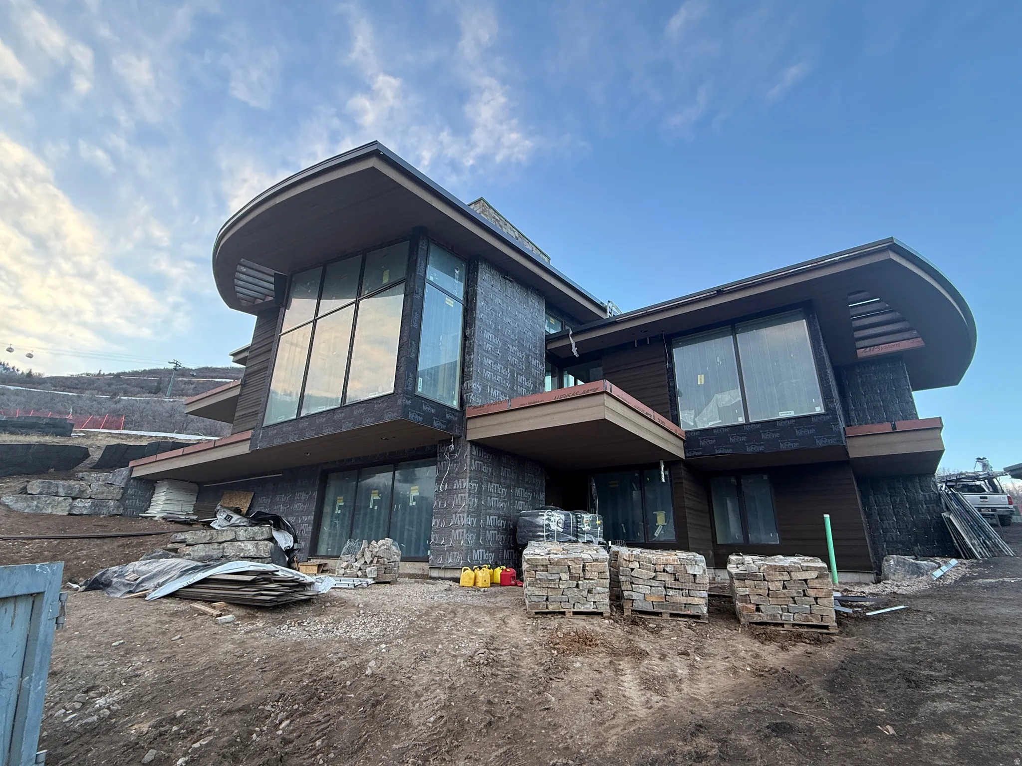 Back of property with stone siding