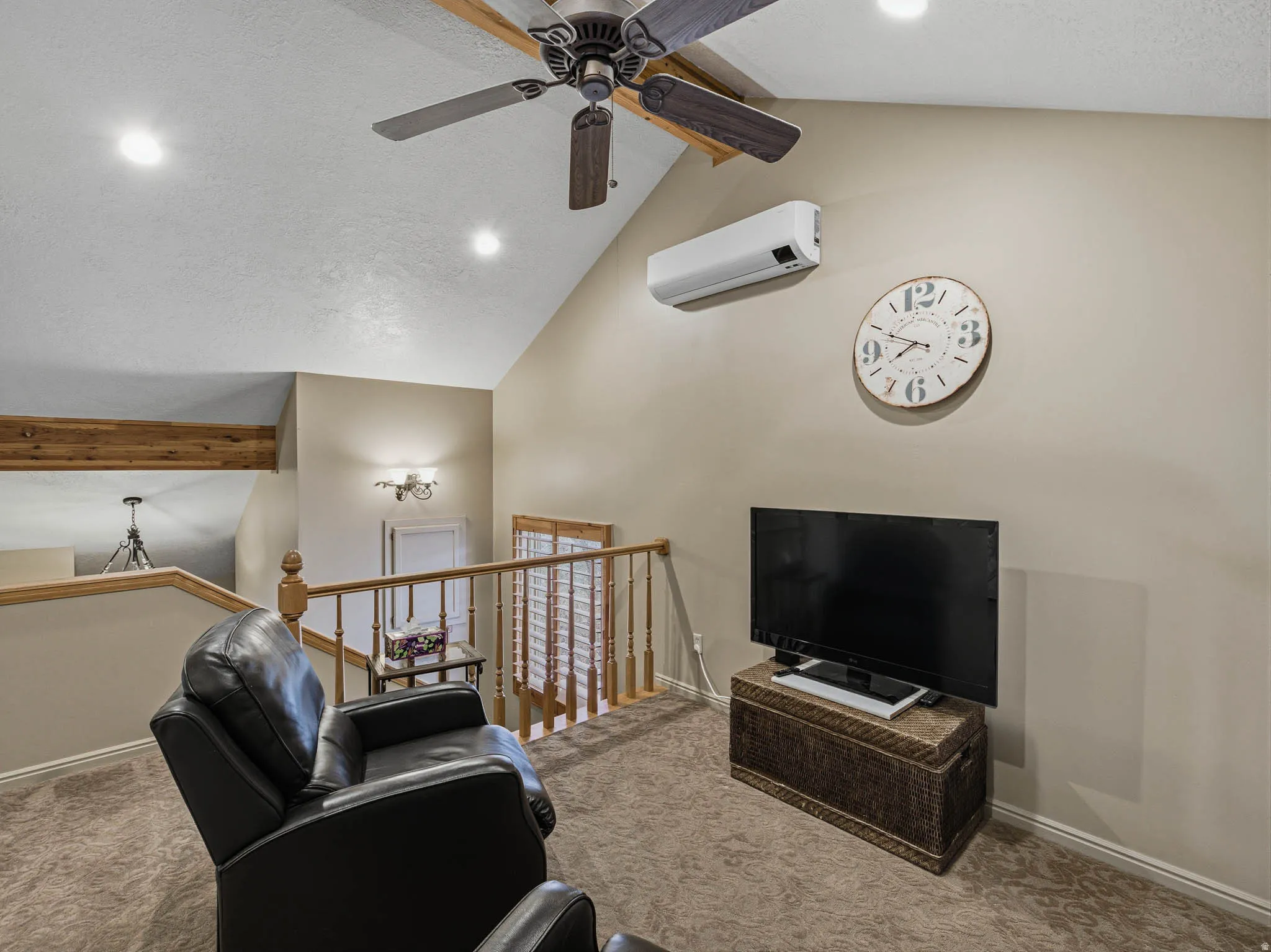 Living room featuring carpet flooring, a high textured ceiling, ceiling fan, and recessed lighting