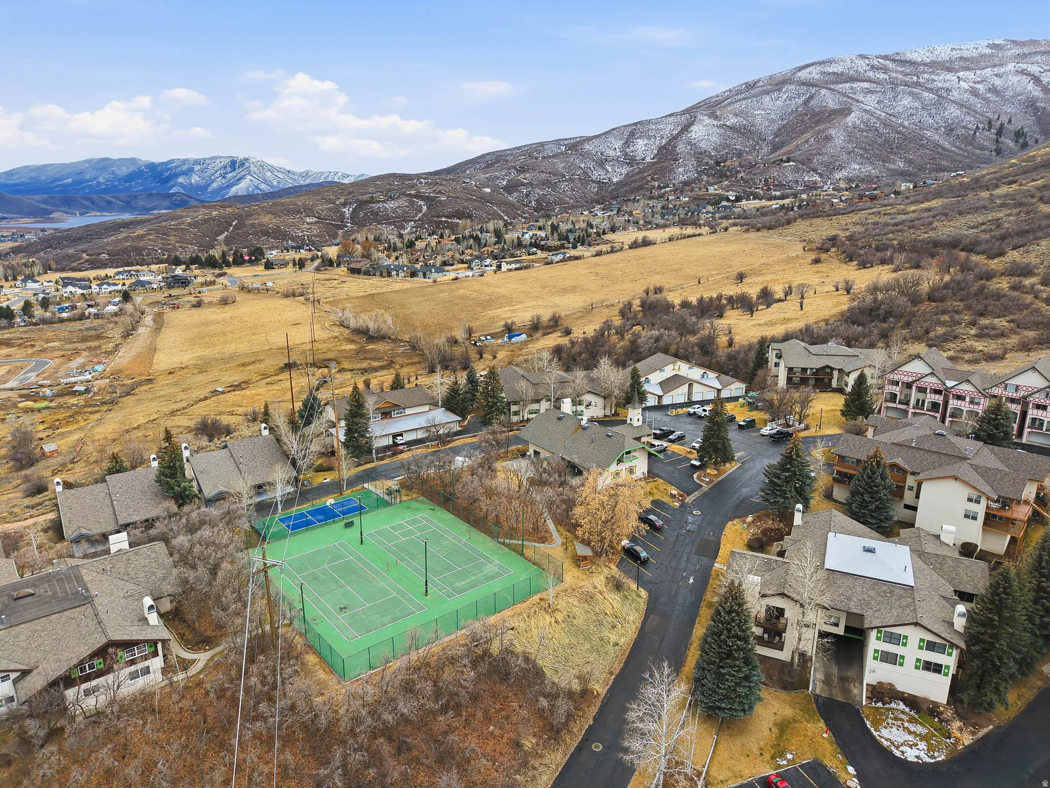 Aerial view of residential area featuring mountains