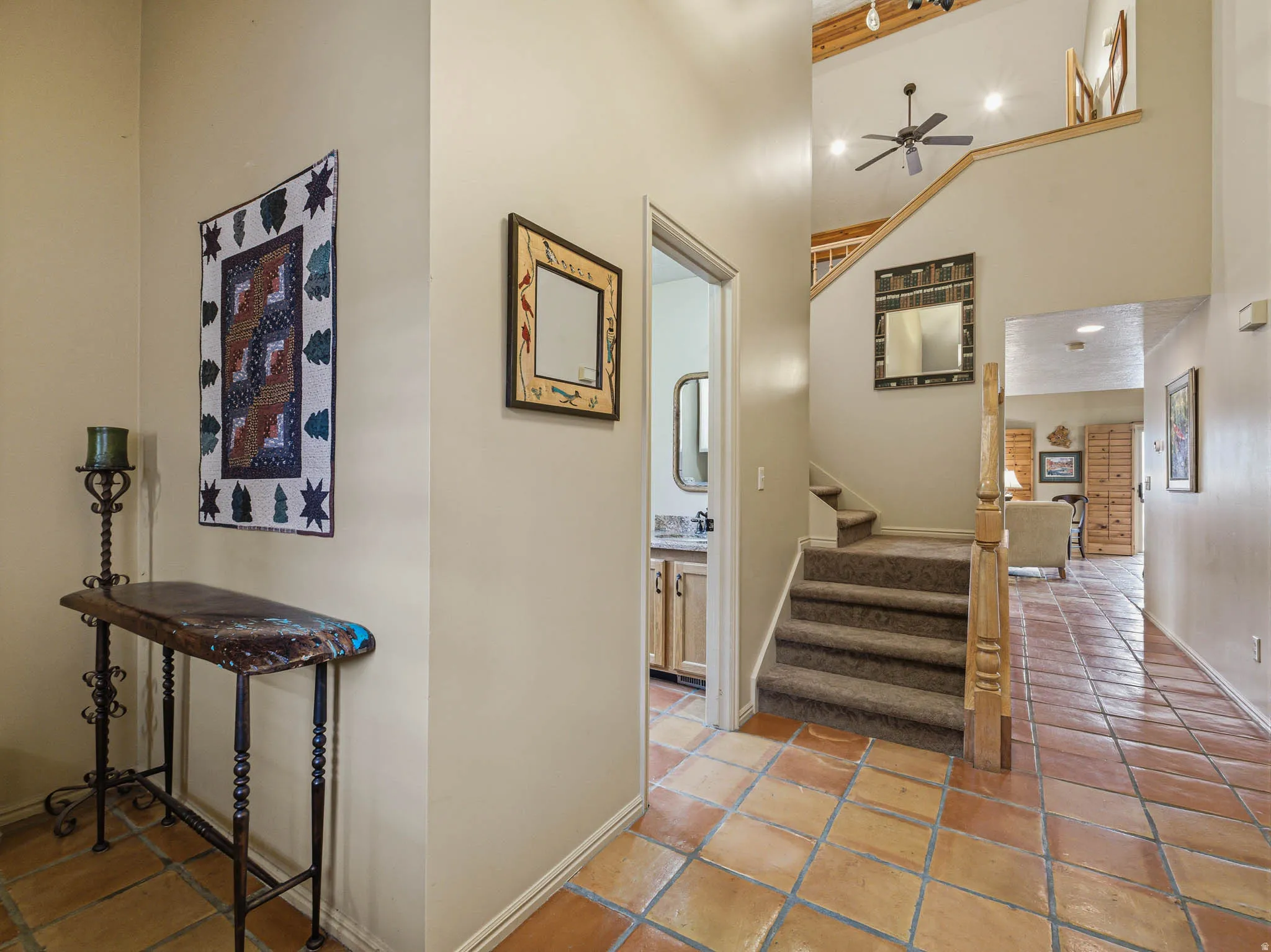 Hall with stairway and light tile patterned floors