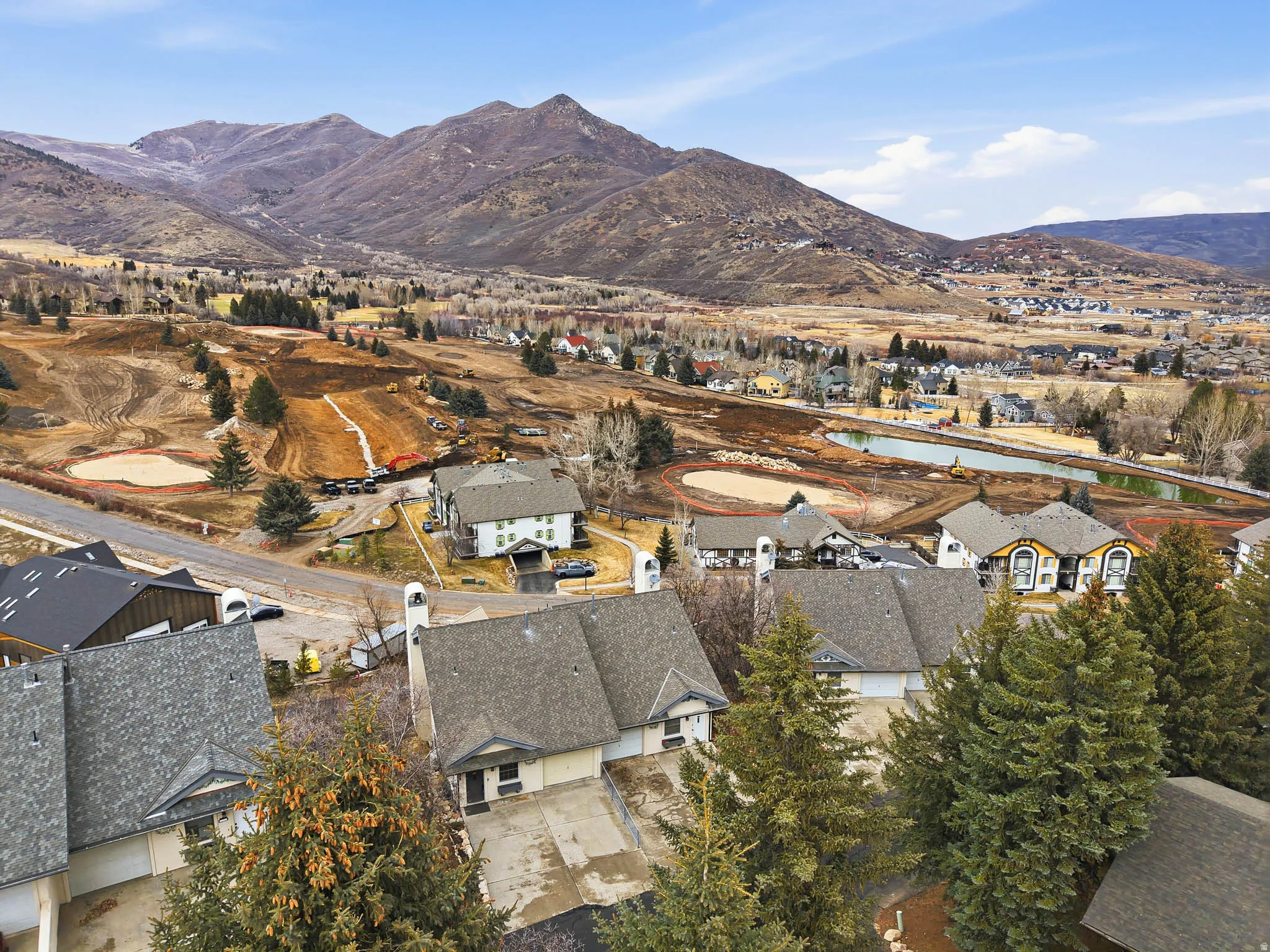 View of property location with nearby suburban area and a water and mountain view