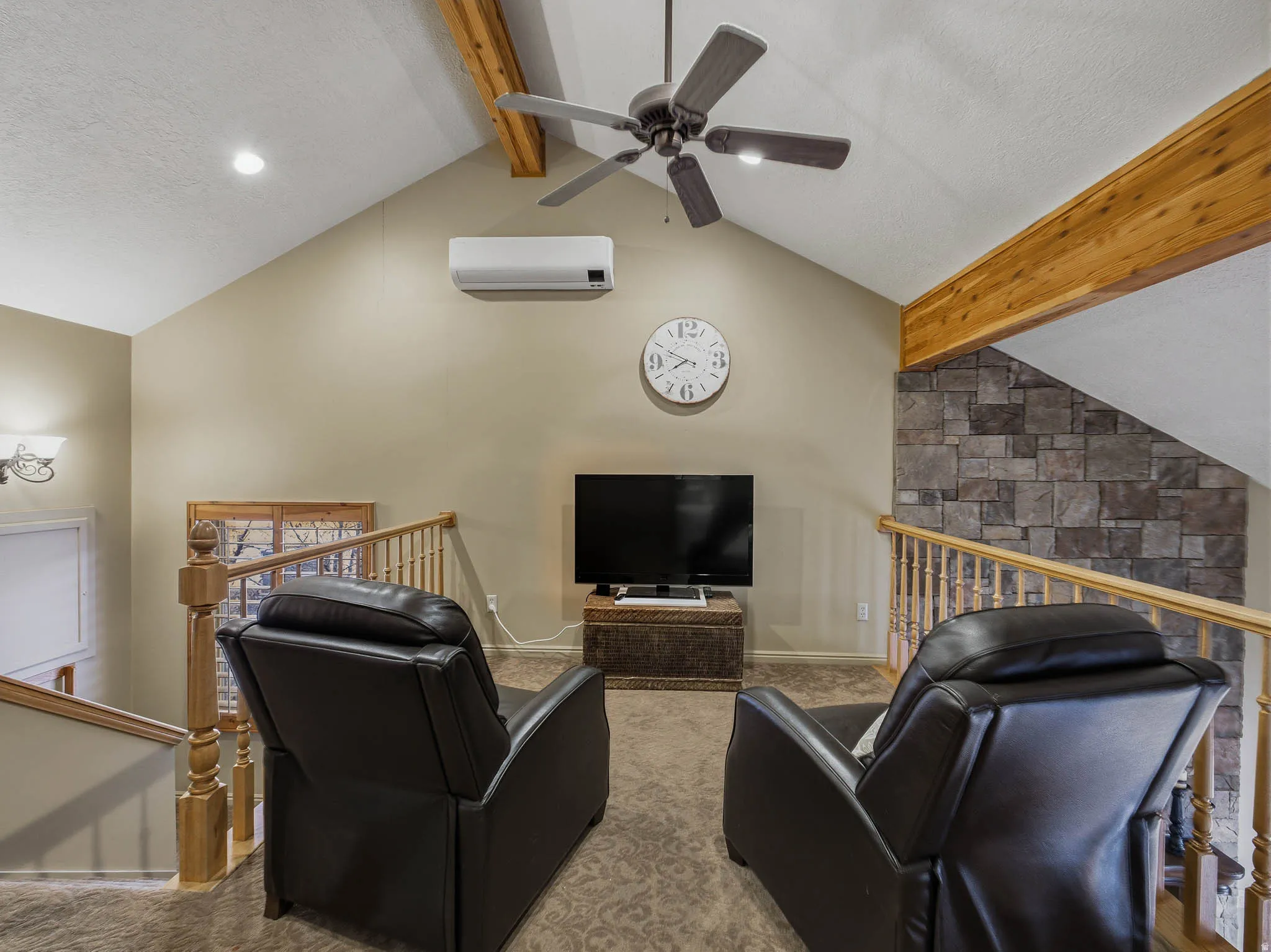 Living area featuring beam ceiling, a textured ceiling, a ceiling fan, carpet flooring, and recessed lighting