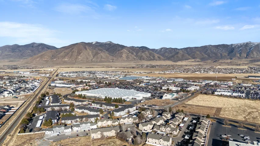 Aerial perspective of suburban area featuring a mountainous background