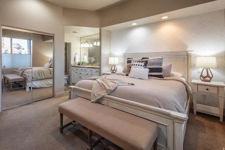 Bedroom featuring carpet, a closet, connected bathroom, and recessed lighting