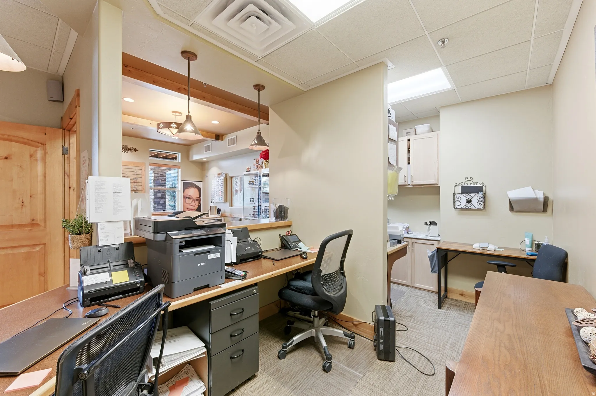Office featuring a drop ceiling