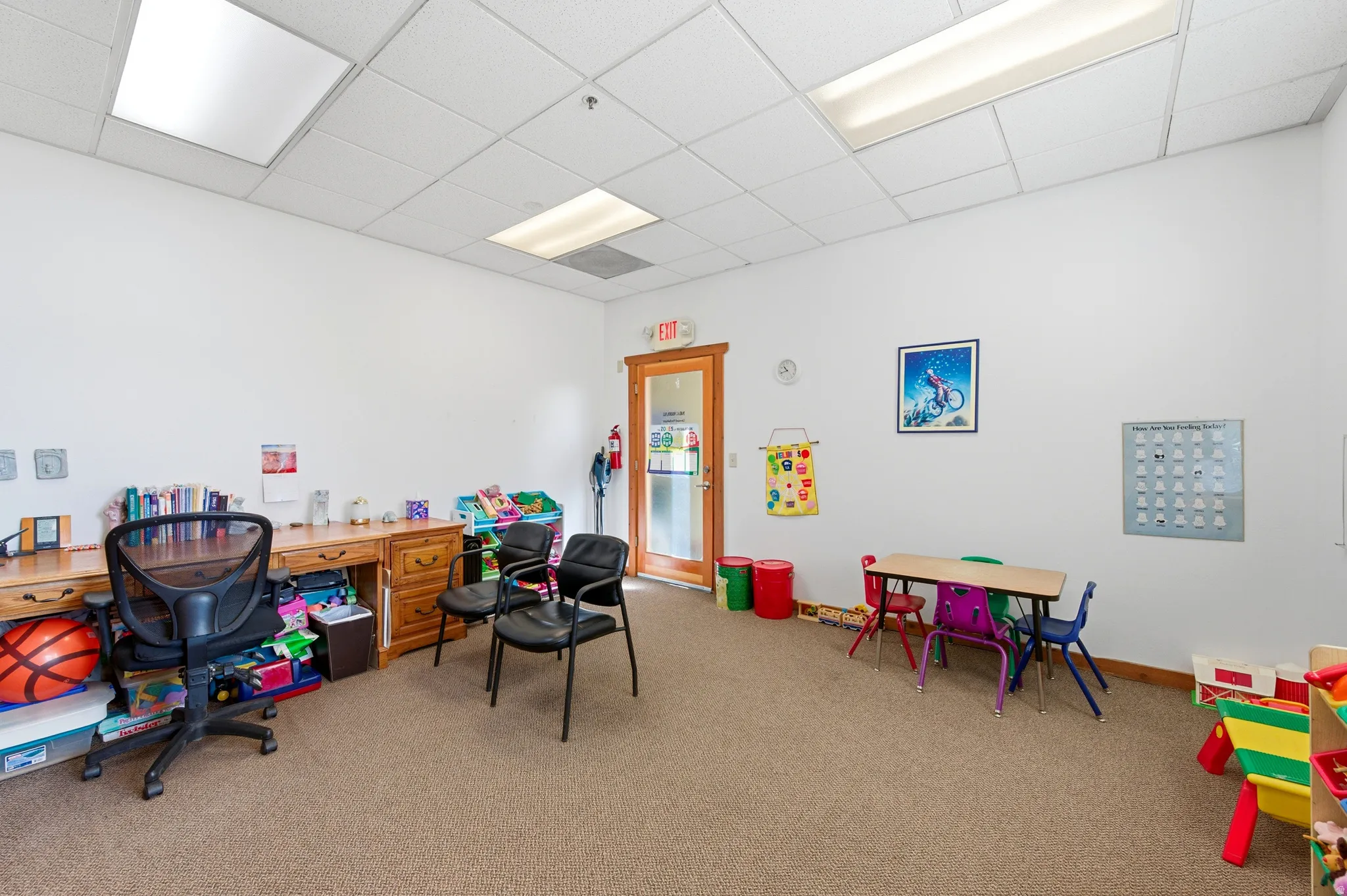 Recreation room featuring a drop ceiling