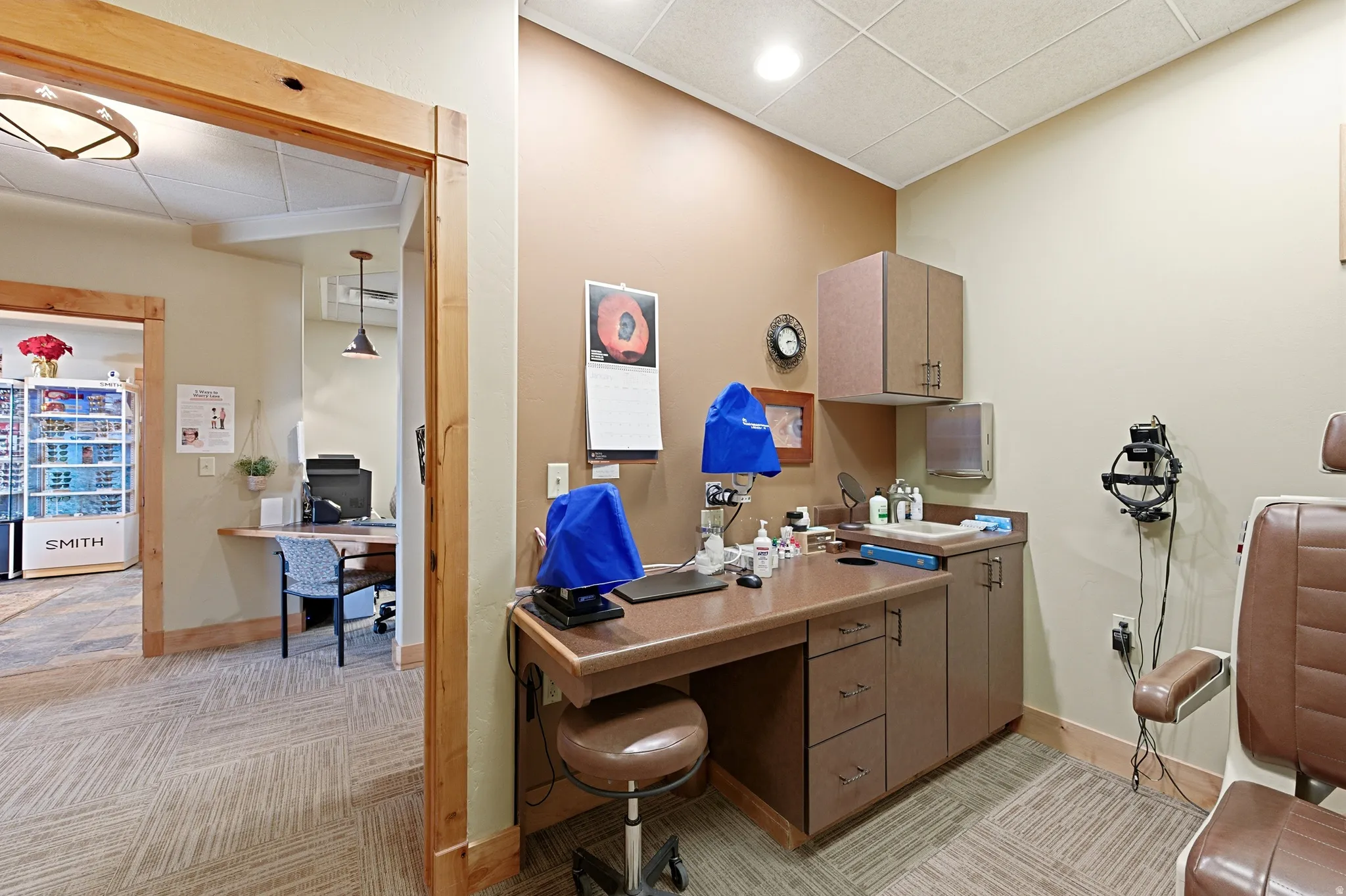 Office with a paneled ceiling