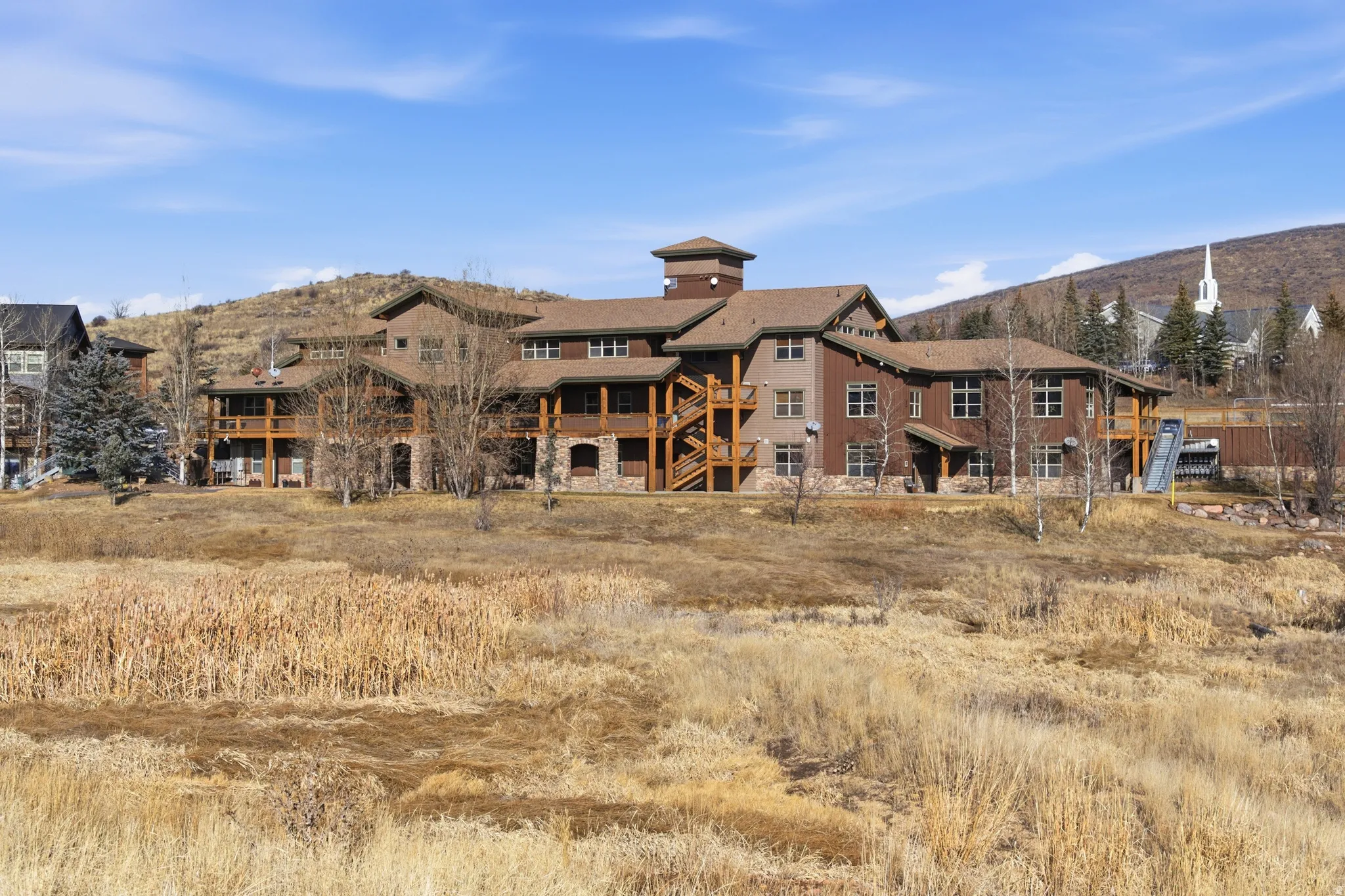 View of apartment building / complex featuring stairway