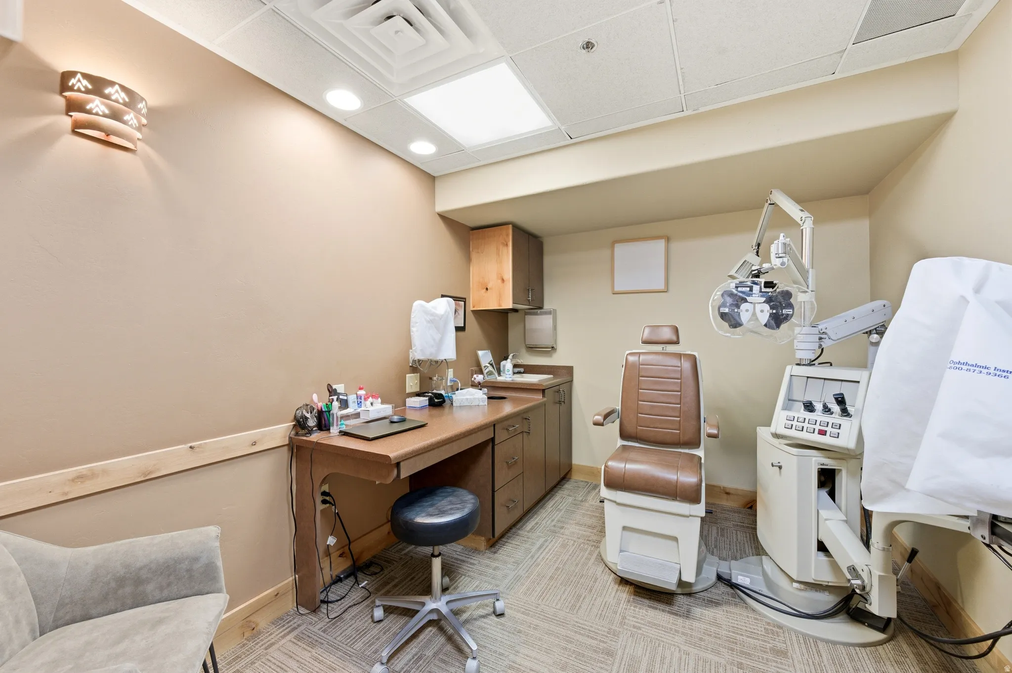 Office with a paneled ceiling and recessed lighting