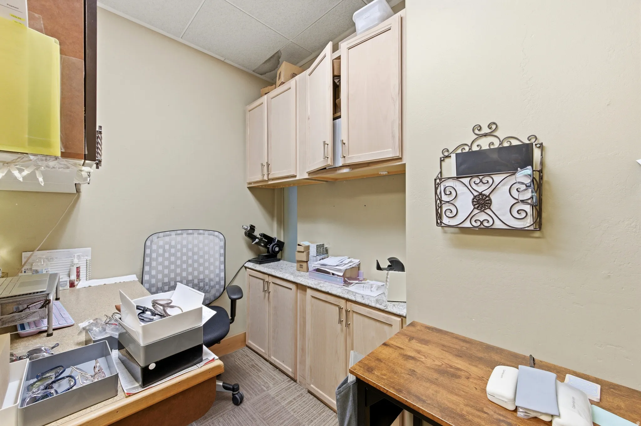 Home office with light colored carpet