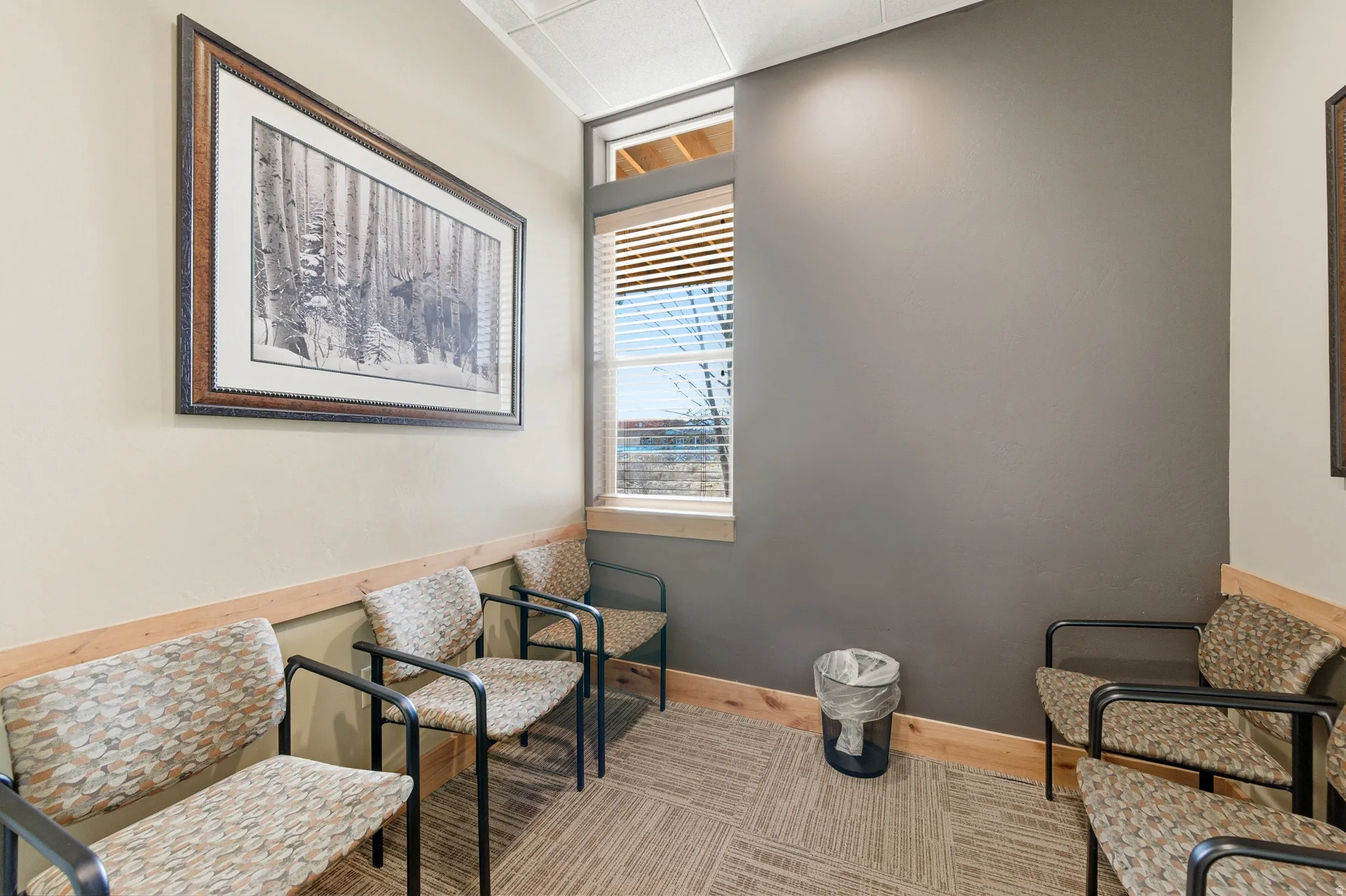 Sitting room with baseboards and wood finished floors
