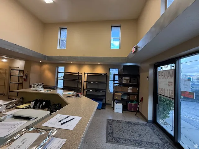 Office area featuring a high ceiling