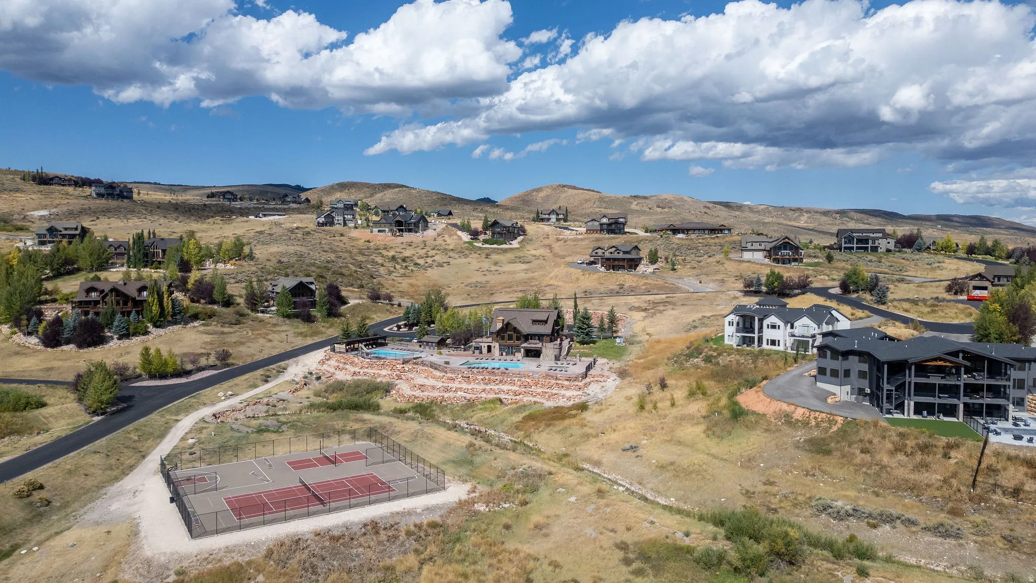 View of property location featuring nearby suburban area and mountains