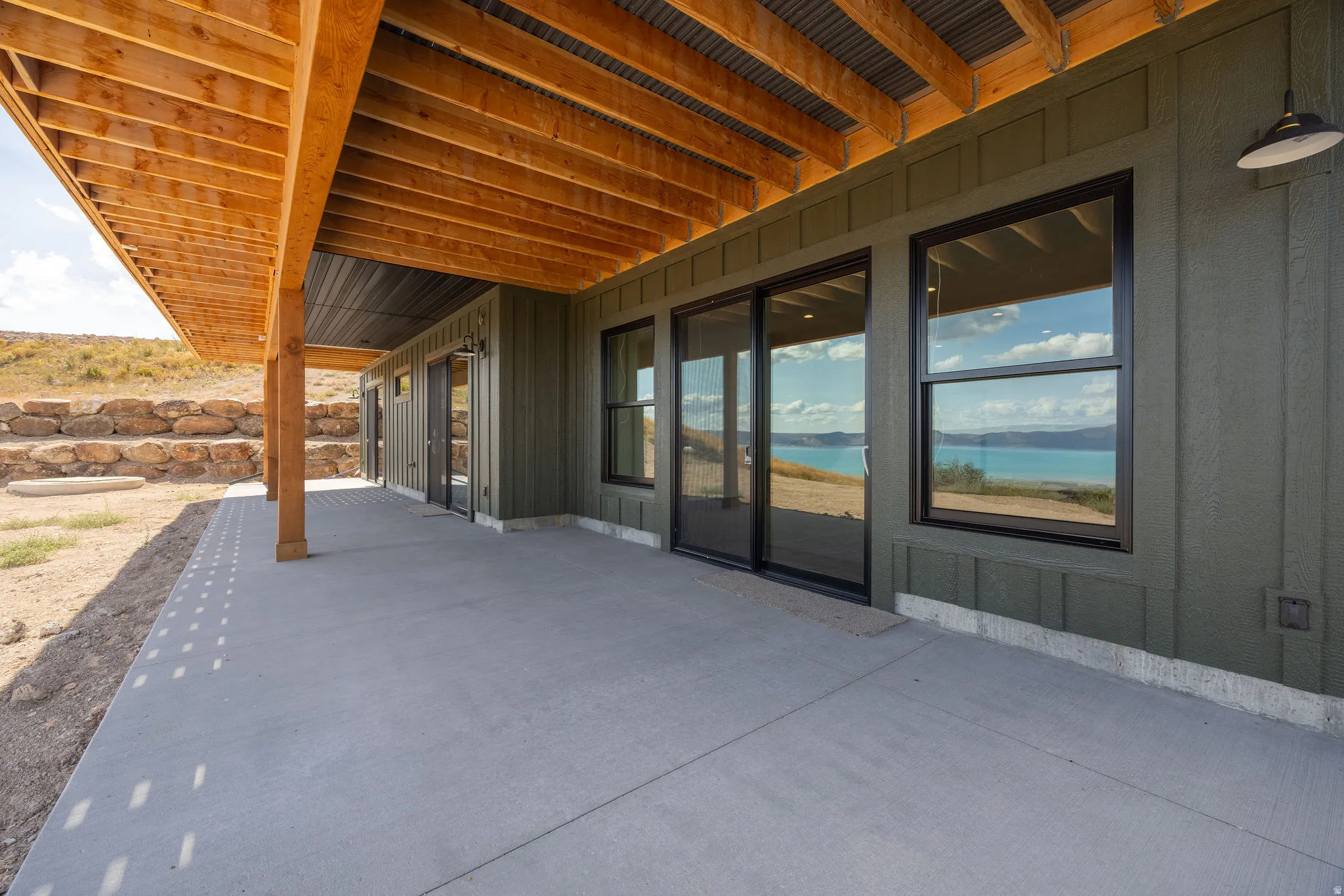 View of patio / terrace with a water view