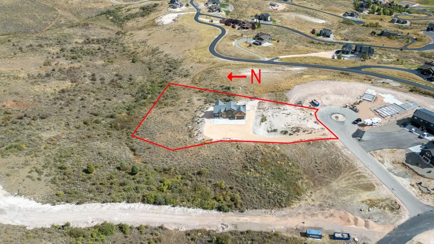 Aerial overview of property's location featuring property parcel outlined and a desert landscape