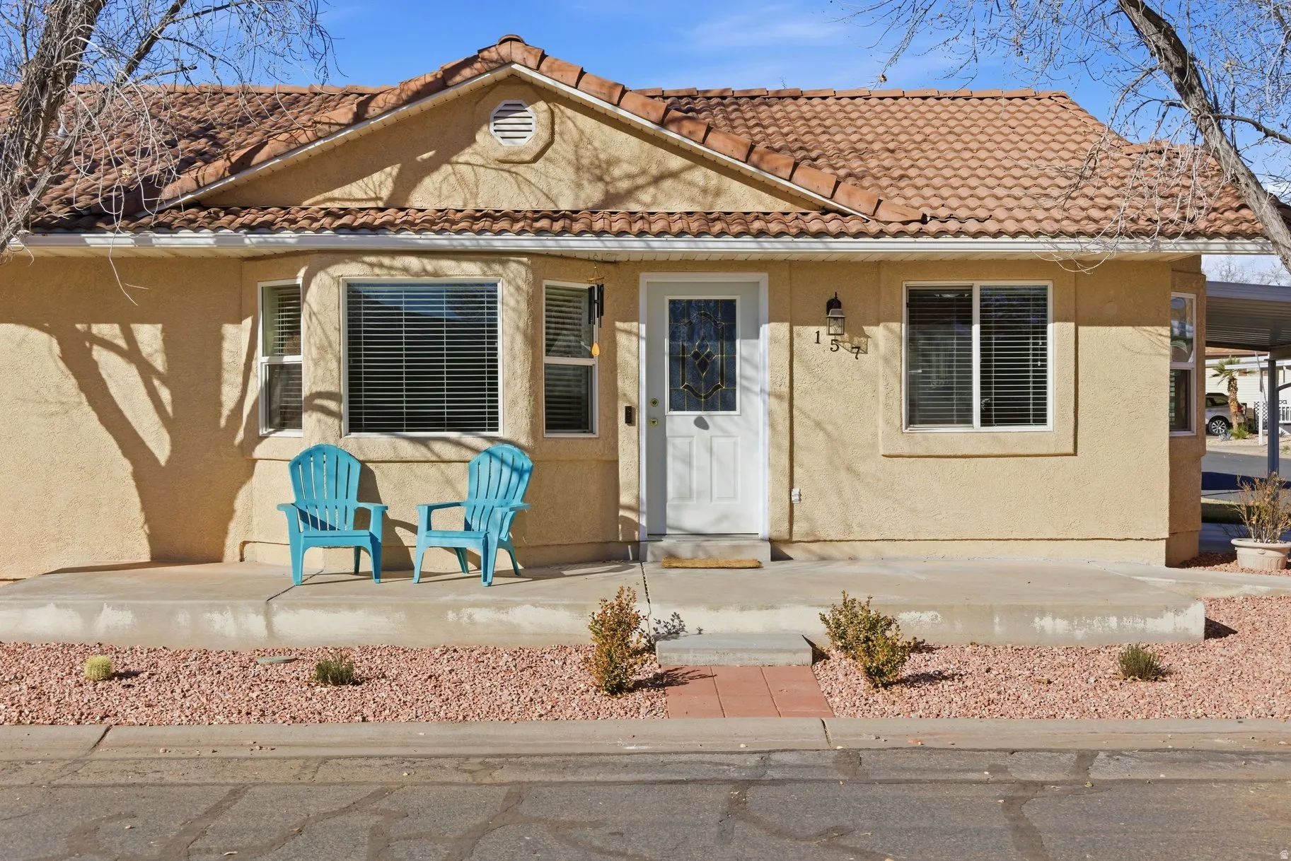 Mediterranean / spanish home featuring stucco siding and a tile roof