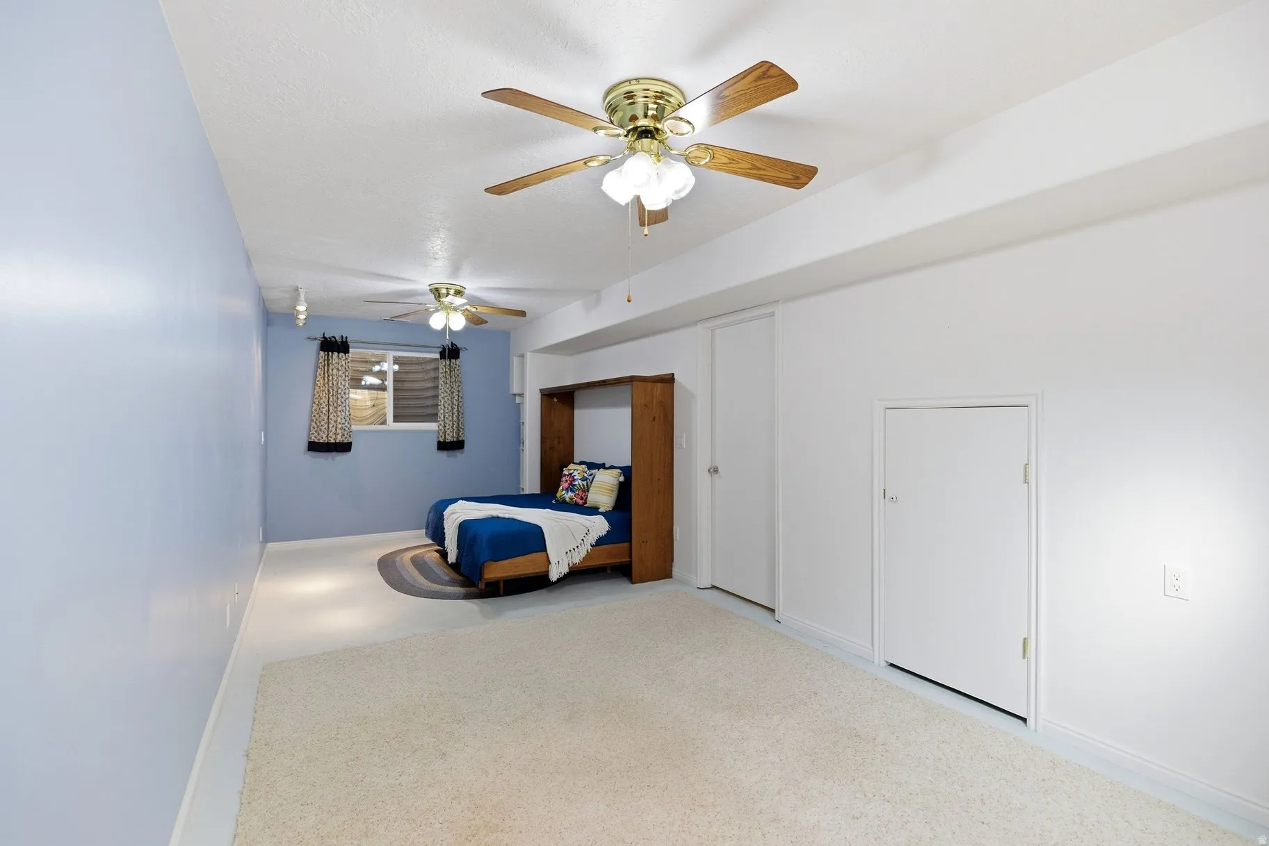 Bedroom with baseboards and ceiling fan