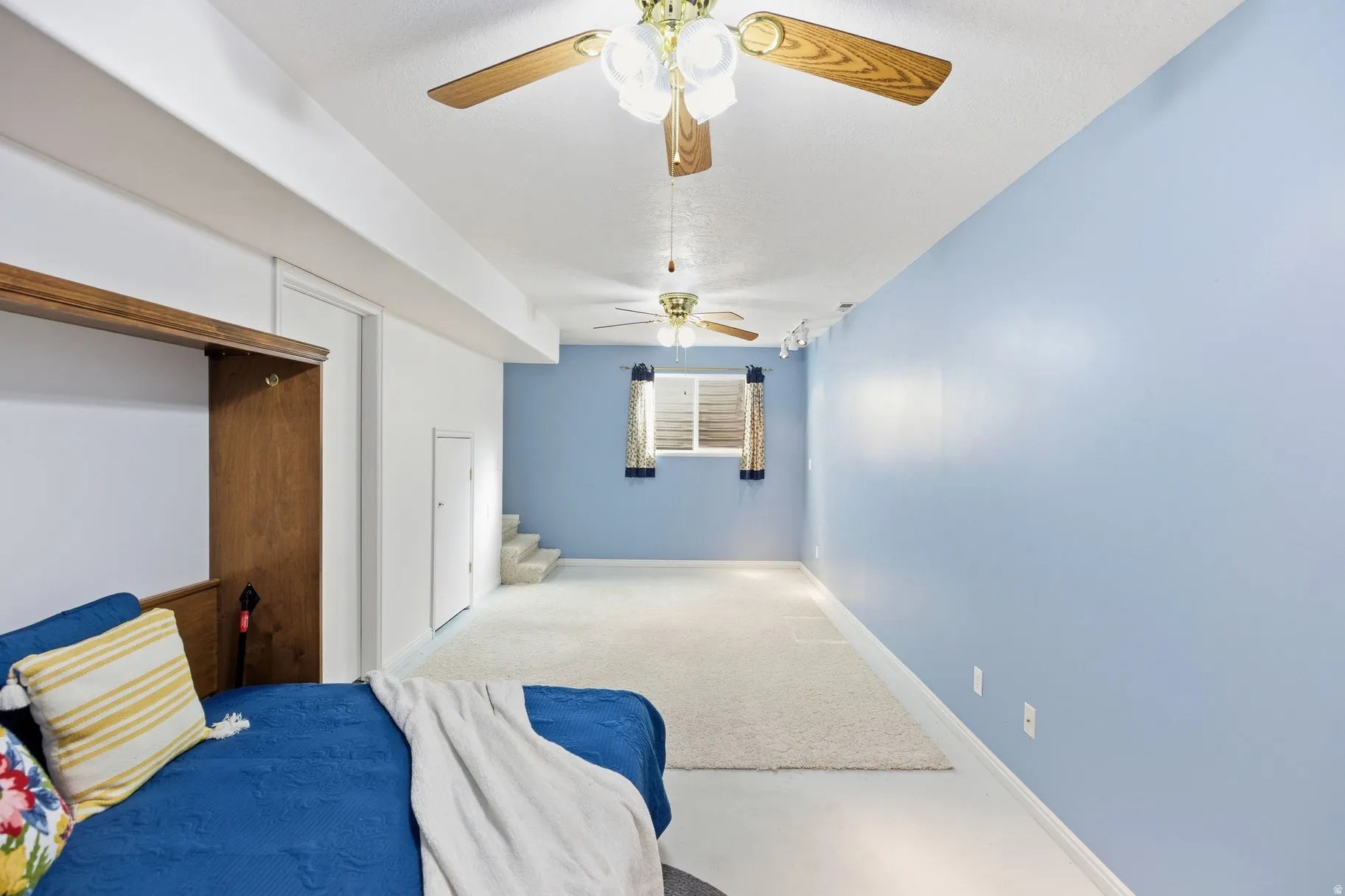 Bedroom featuring a ceiling fan, carpet floors, and a closet