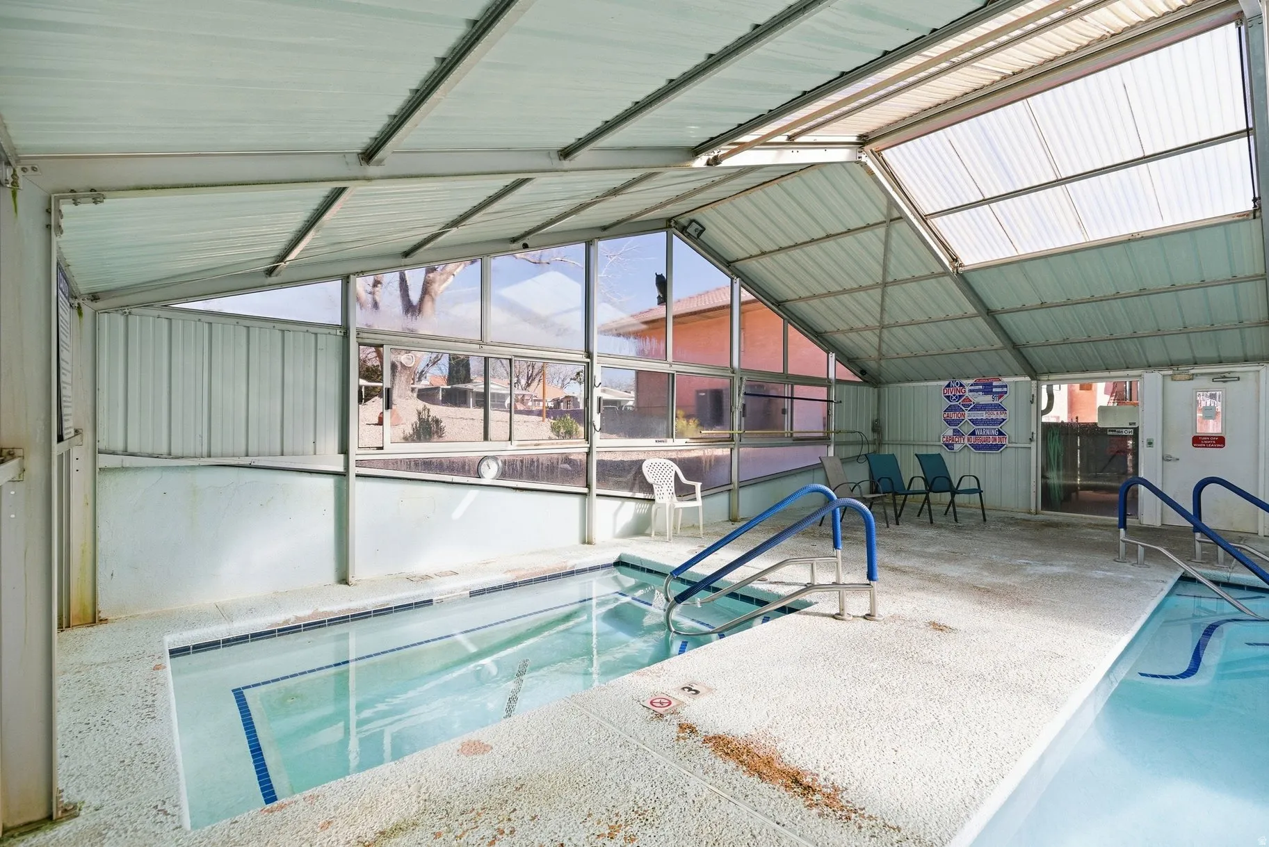 Indoor pool with a sunroom