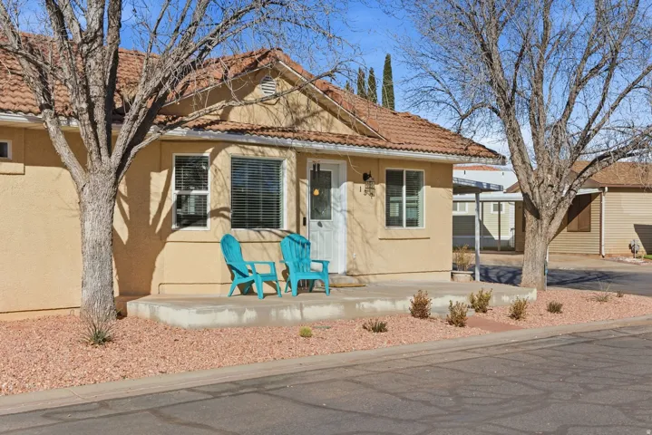 View of front of home featuring stucco siding and a tiled roof