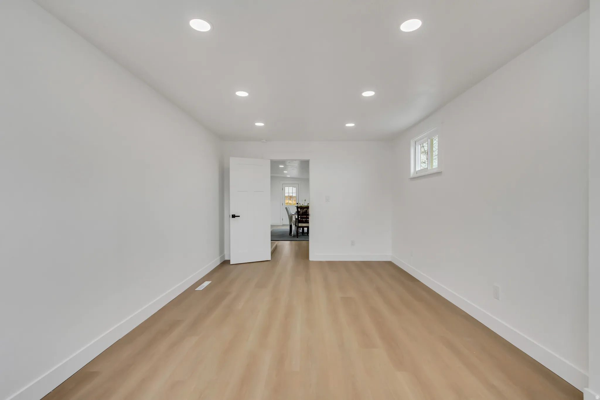 Spare room with light wood-style flooring and recessed lighting