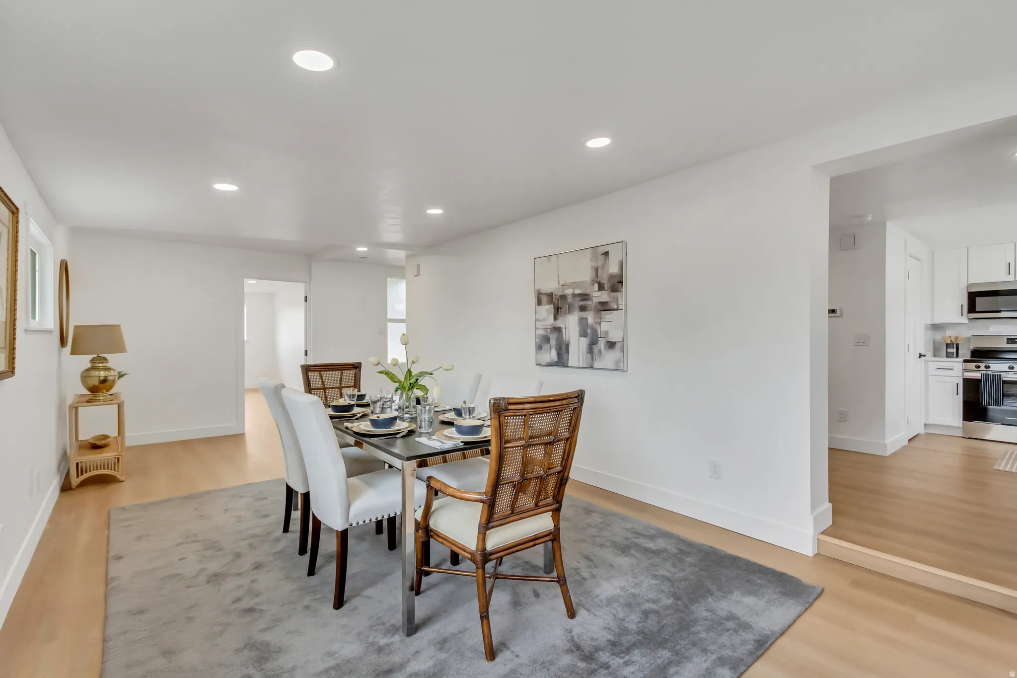 Dining area featuring light wood-style flooring and recessed lighting