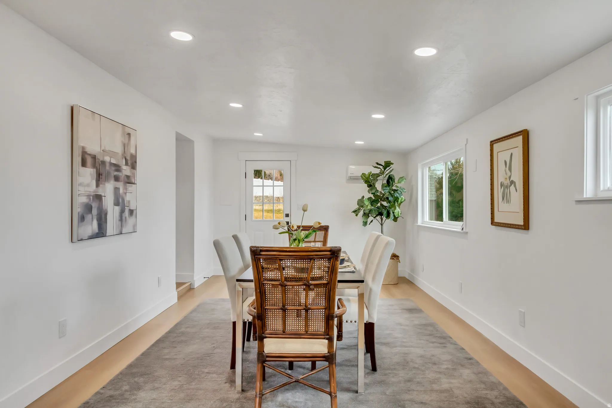 Dining room featuring light wood finished floors and recessed lighting
