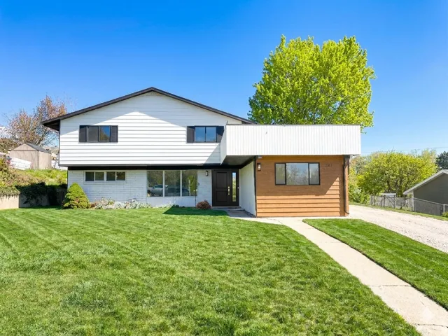 View of front of house featuring brick siding