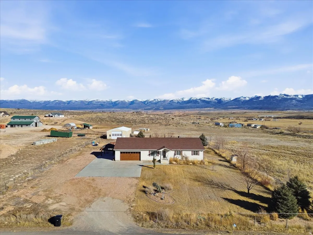 Aerial view of sparsely populated area with a mountain backdrop