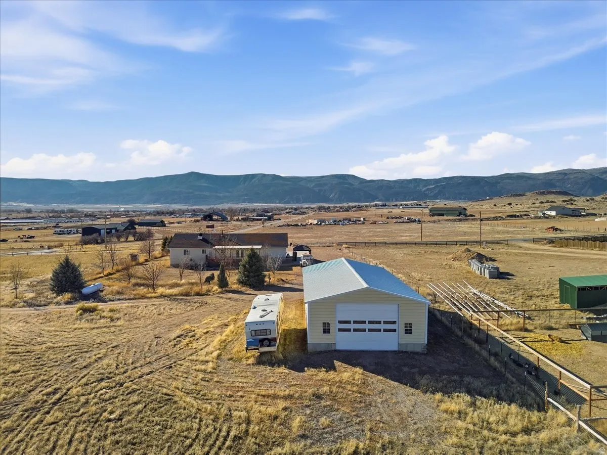 Aerial view of sparsely populated area featuring a mountainous background